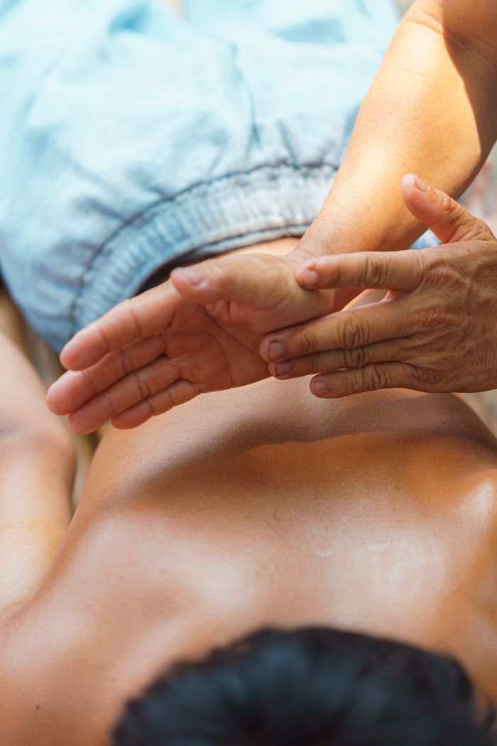 Close-up of a relaxing massage therapy session, showcasing expert hand techniques for stress relief.