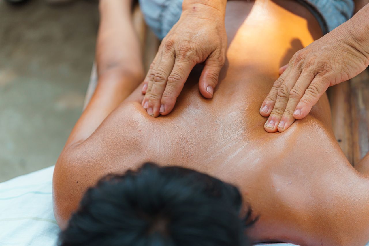 A soothing outdoor massage session focusing on relaxation and wellness, enhancing physical and mental health.
